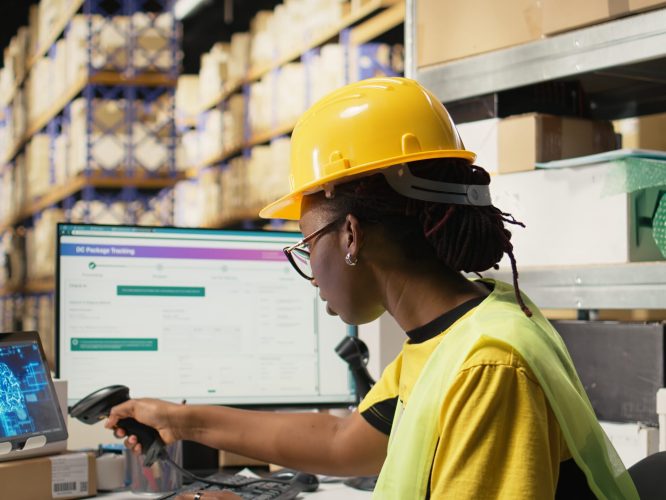 Woman uses AI-generated software for order processing automation, advanced neural networks cloud computing system ensures parcel tracking with a computer in warehouse with racks. Camera A.